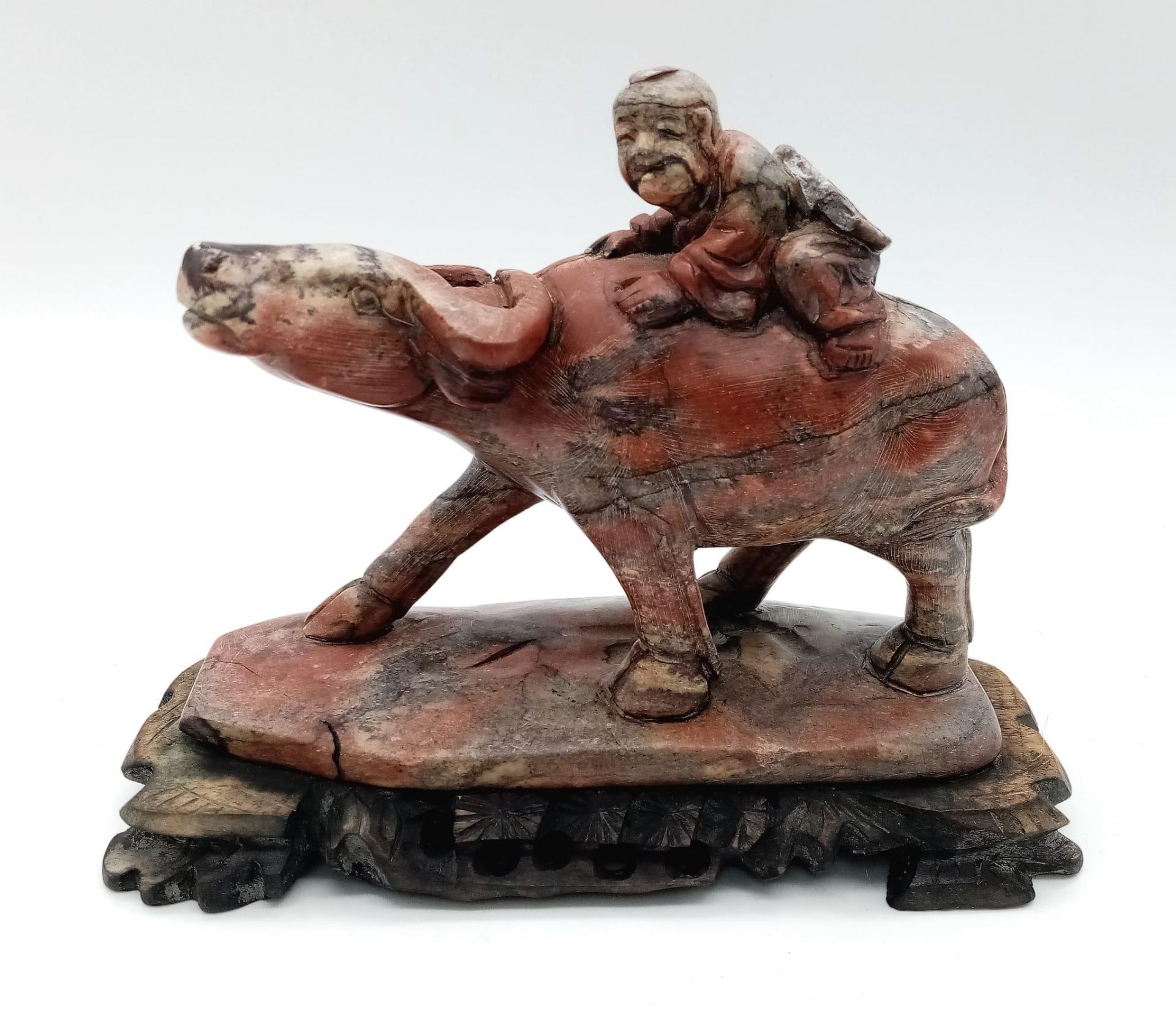 A wonderful Hardstone Chinese Antique Figure on a wooden base. Lovely red, grey and white colours in