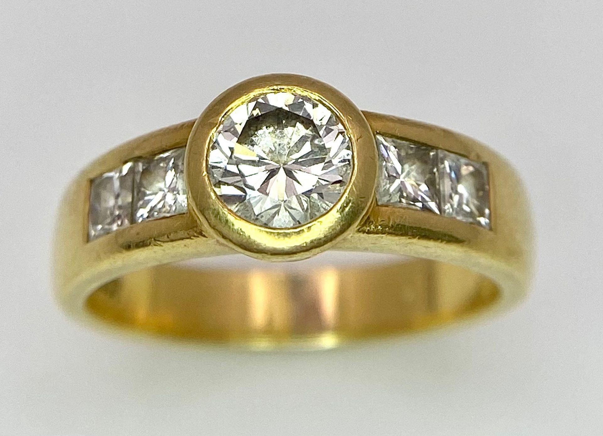An 18K Yellow Gold Diamond Ring - Main 0.45ct bright white centre stone with 0.35ctw of diamond - Image 2 of 9