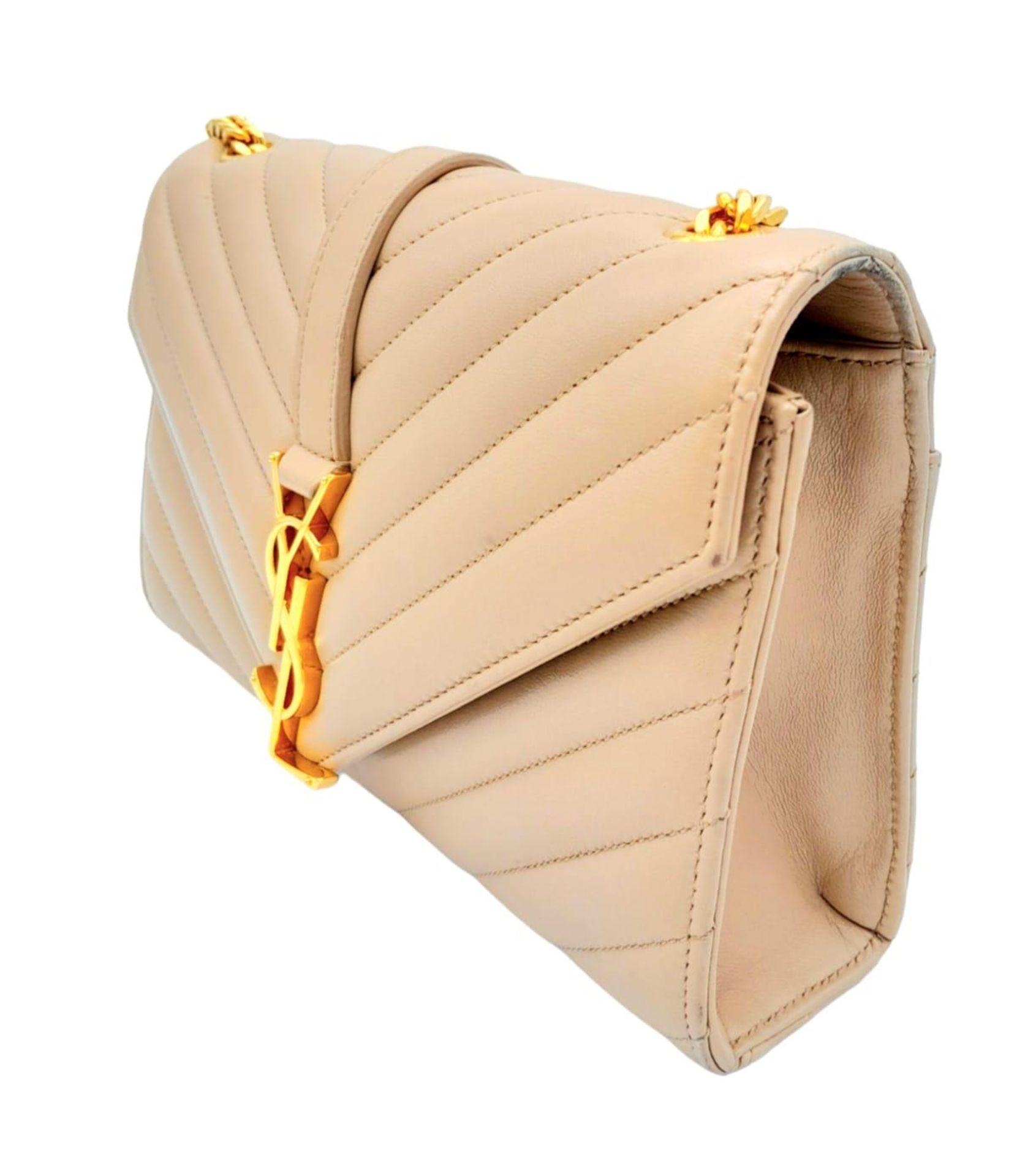 A Saint Laurent envelope shoulder bag, soft beige calfskin with gold hardware and strap, press - Image 3 of 11