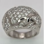 A Chanel, Designer 18K White Gold Diamond Encrusted Ring. This head-turning piece has