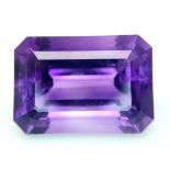 A large (92.03 carats), octagonal step cut AMETHYST, with excellent vivid and uniform colouration