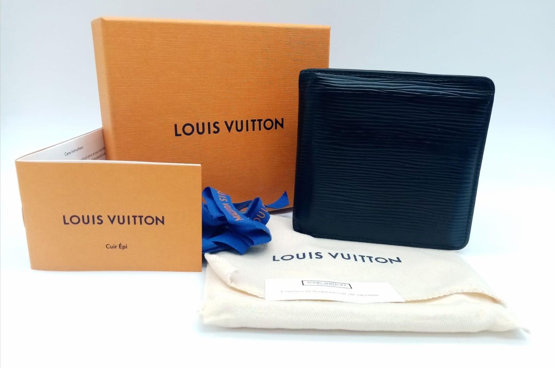 A Louis Vuitton black cowhide leather wallet. Engraved with initials SRD. Size approx. 11x11cm.