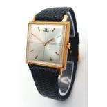 A Vintage Jaeger Le Coultre Thin Mechanical Gents Watch. Black leather strap. 18K gold case -