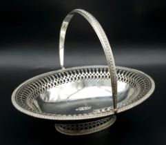 An Antique Sterling Silver Oval Swing Handled Cake/Bread Basket. Pierced geometric and beaded