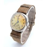 A Vintage Buren (1940s) Mechanical Gents Watch. Textile strap. Stainless steel case - 30mm. Patinaed