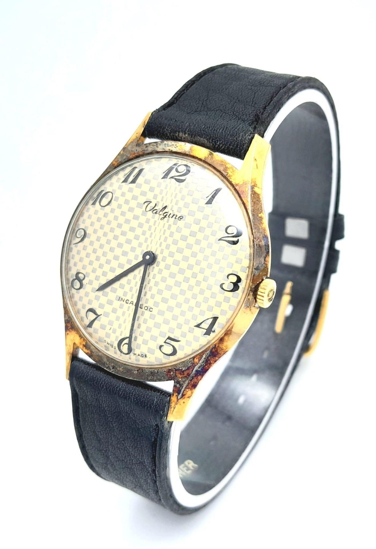 A Vintage Valgine Mechanical Gents Watch. Black leather strap. Gilded stainless steel case - 34mm.