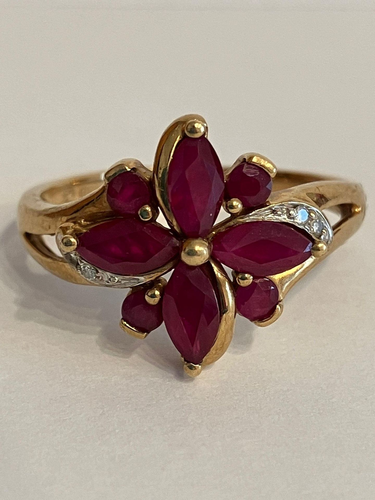Beautiful 9 carat GOLD, DIAMOND and RUBY DRESS RING. Consisting Marquise and Round cut RUBIES with