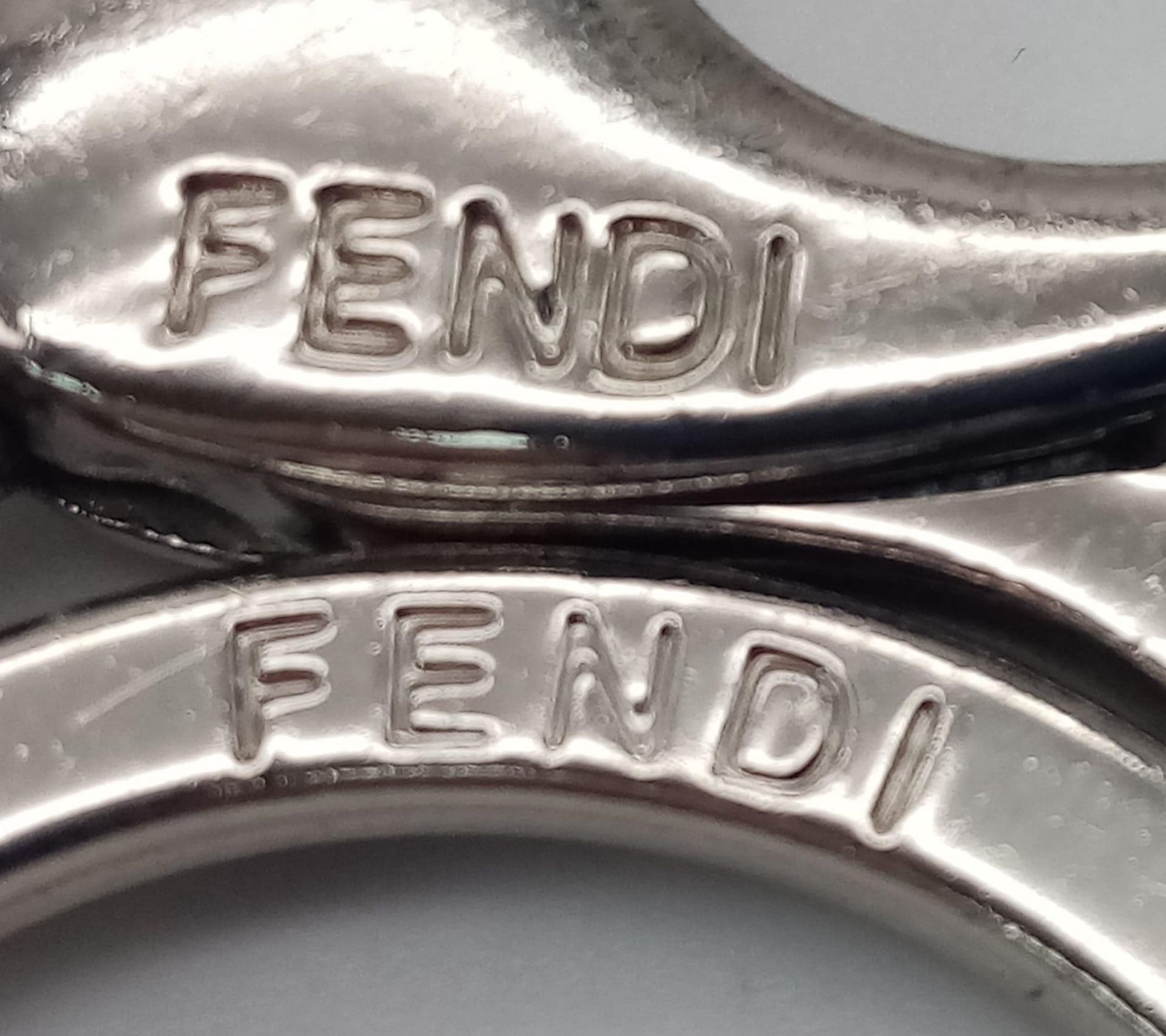 A red leather Fendi monster keychain, silver tone hardware. Diameter6cm. Comes with box. ref:16444 - Image 4 of 5