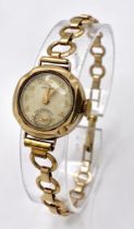 A Vintage 'Magnat' 9K Gold Ladies Watch. 9k gold bracelet and case - 21mm. Cream dial with second