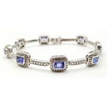 An Exquisite Sterling Silver and Eight Rectangle Cut Tanzanite Set Bracelet. Complete with