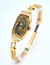 A 9K Gold Cased Vintage Watch. In need of repair so a/f. Bracelet is rolled gold.