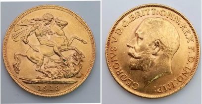 A GEORGE V 22K GOLD SOVEREIGN DATED 1913 .
