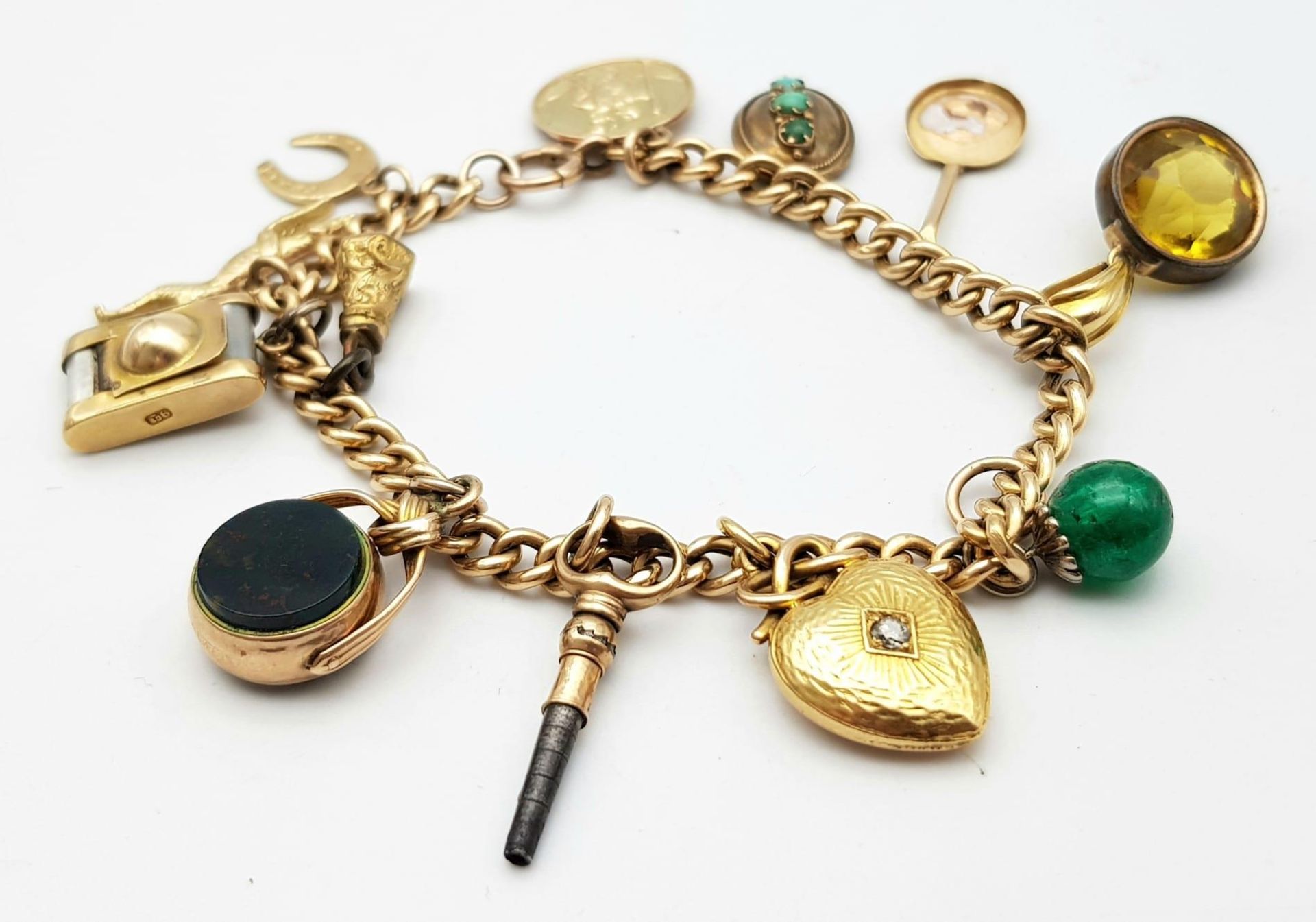 A Vintage 9K Yellow Gold Charm Bracelet. Includes: Diamond heart, carnelian fob and St - Image 12 of 15