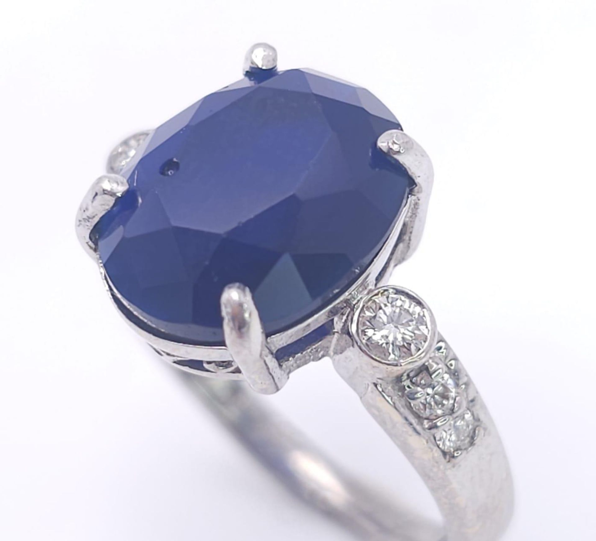 An 18K White Gold Sapphire and Diamond Ring. Central 3ct sapphire with diamond accents. Size M. 4. - Image 3 of 6