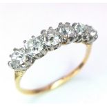 A Stunning 18K Gold (tested) Six Stone Diamond Ring. 1.5ctw of brilliant round cut diamonds. Size