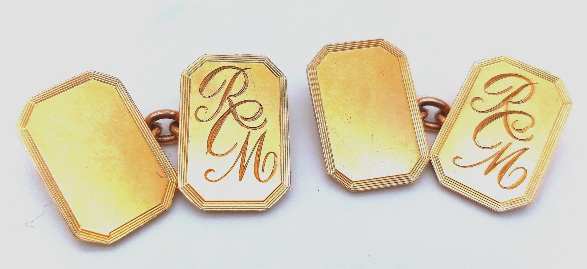 A VINTAGE PAIR OF CHAIN LINK CUFFLINKS WITH THE INITIALS "R.C.M." AND PRESENTED BY THE HEINZ COMPANY