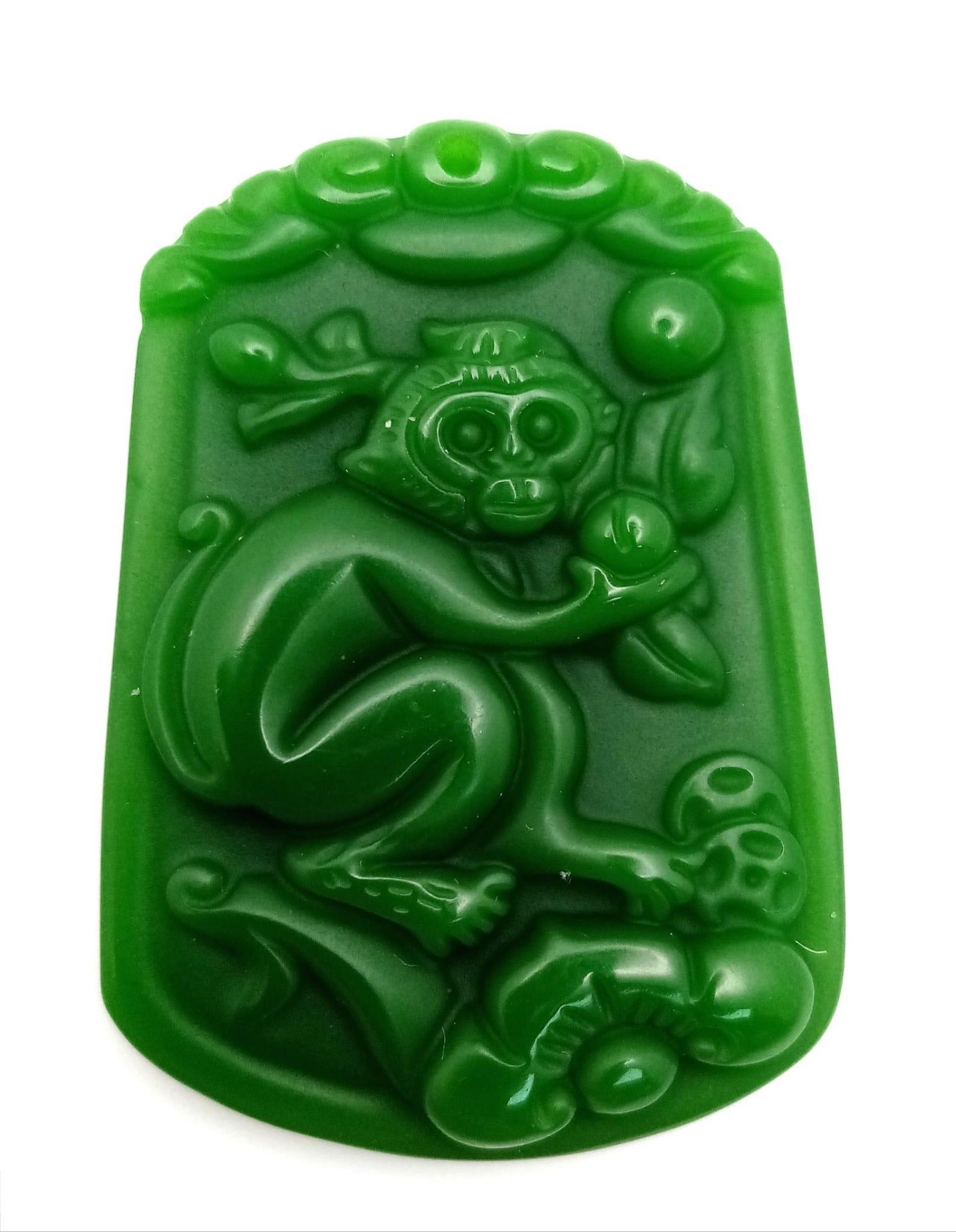 A Decorative Monkey Green Jade Pendant. 4cm x 3cm