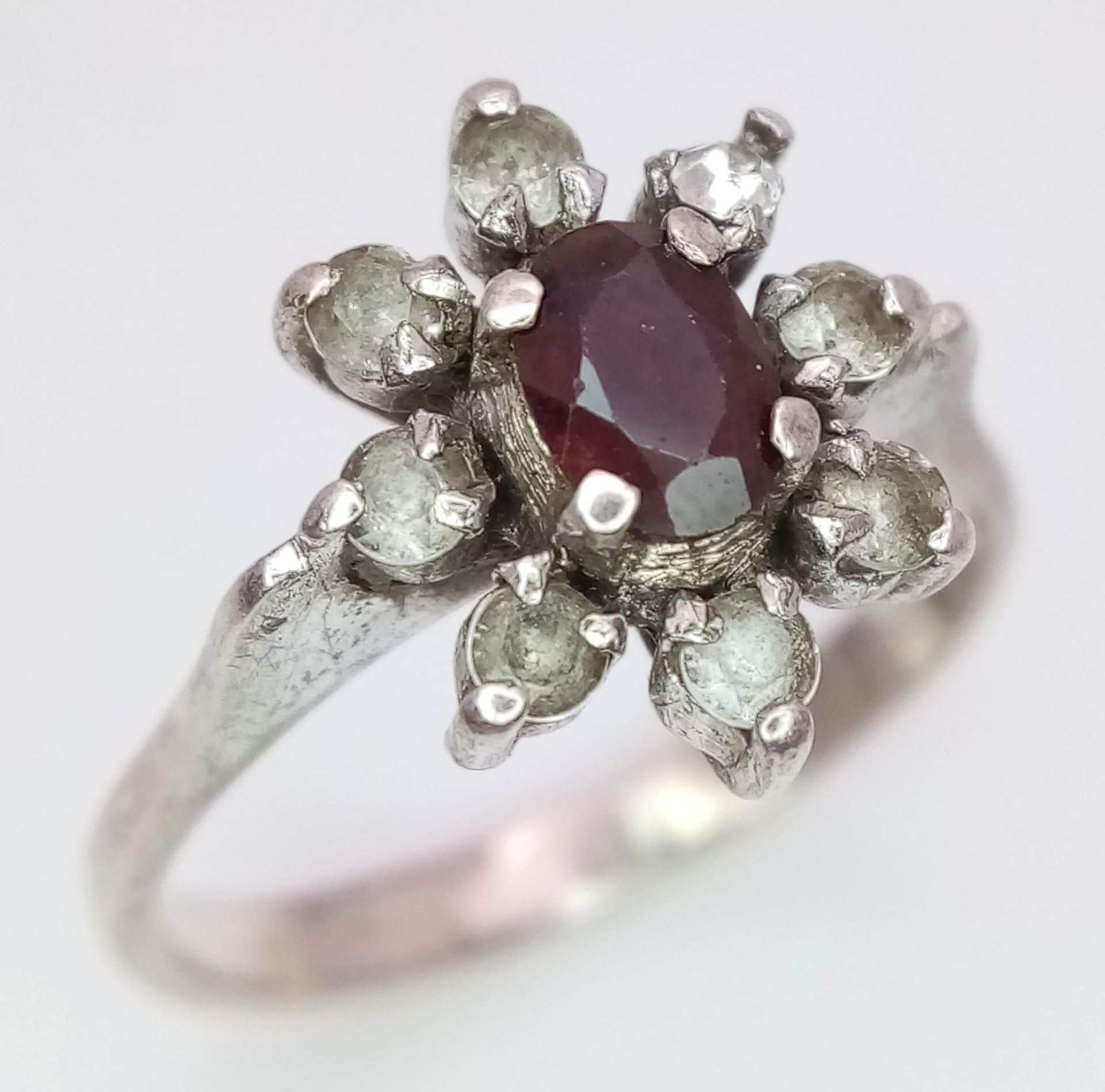 A fancy 925 silver Zirconia and Garnet floral cluster ring. Total weight 2.5G. Size K. - Image 2 of 7