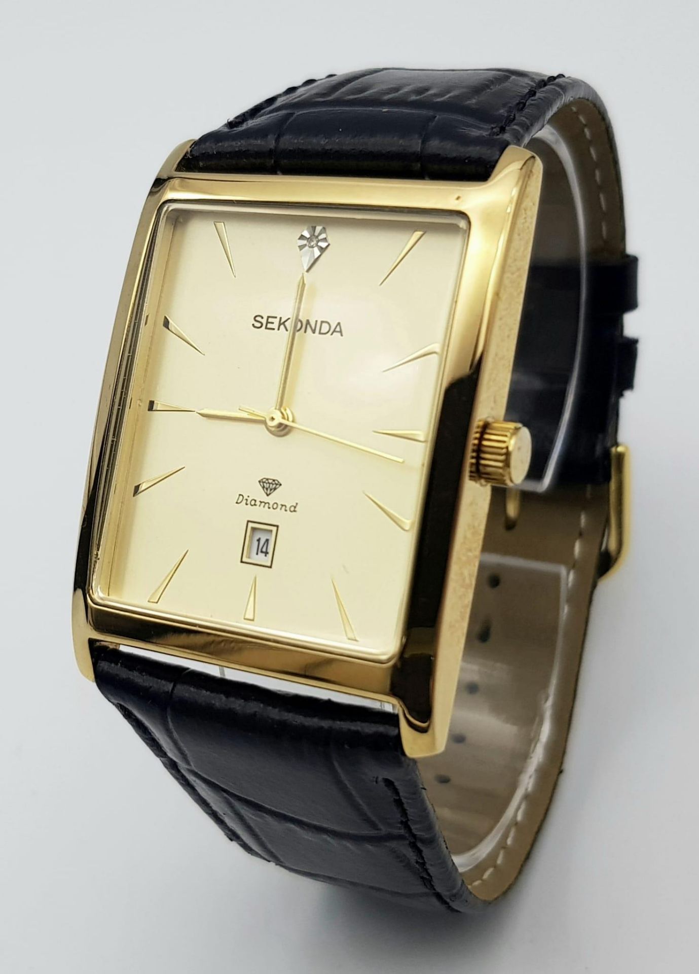 A Sekonda Diamond Gents Quartz Watch. Black leather strap. Gilded rectangular case - 32mm. Gold tone