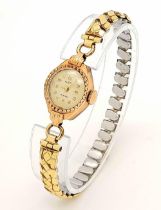 A Vintage 14K Gold Cased Alsta Ladies Mechanical Watch. Gold plated expandable bracelet. 14k gold