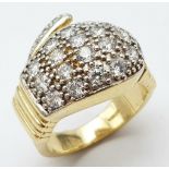 AN IMPRESSIVE 9K YELLOW GOLD STONE SET BOXING GLOVE RING, WEIGHT 15.1G SIZE W