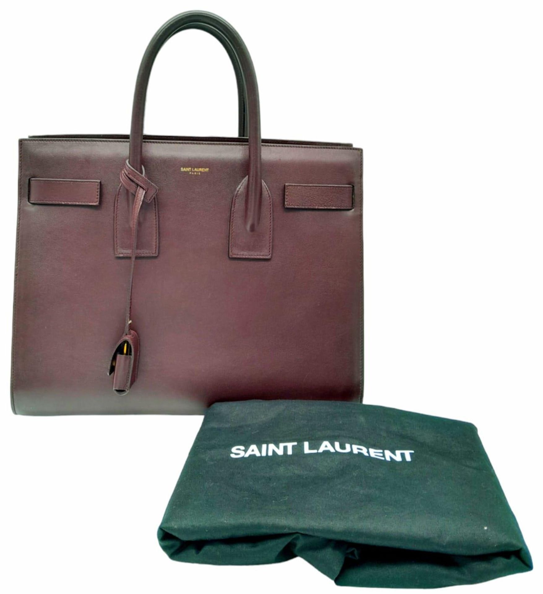 A Saint Laurent Sac De Jour Burgundy Handbag. Leather Exterior, Gold Tone Hardware, Double Handle in - Image 2 of 11
