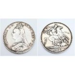 An 1889 Queen Victoria Silver Crown Coin. VF+ grade but please see photos for conditions.