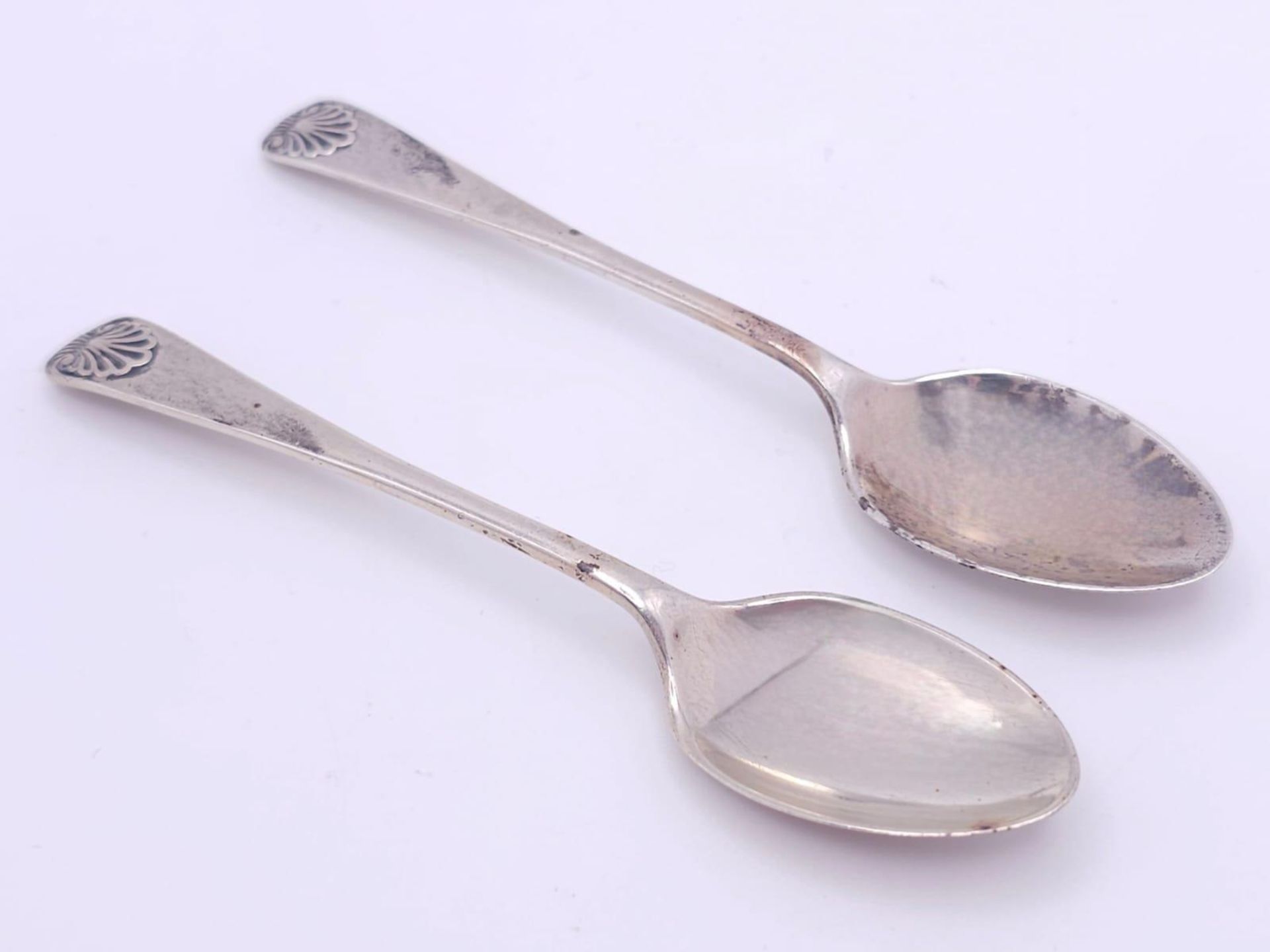A pair of antique sterling silver tea spoons. Full hallmarks Sheffield, 1918. Total weight 22.7G.