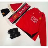 A Collection of Manchester United Clothing: Nike Red Shirt - AIG (XL), Scarf, Xmas Hat, Beenie hat