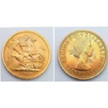 A 22K GOLD SOVEREIGN DATED 1965 .