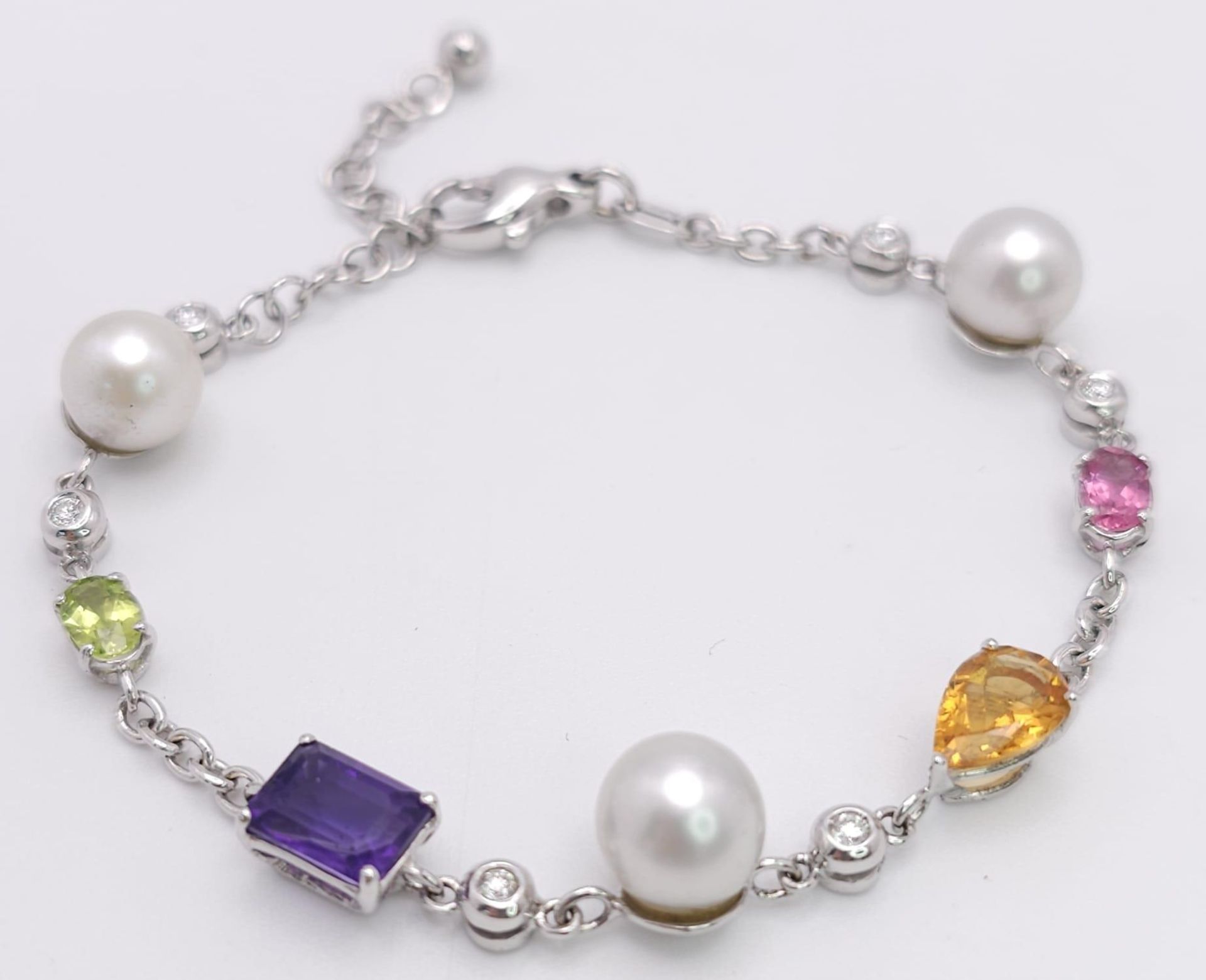 An 18 K white gold chain bracelet with a variety of gemstones (peridot, amethyst, citrine, etc) - Image 2 of 6