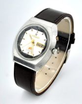 A Vintage Ricoh 21 Jewels Automatic Gents Watch. Brown leather strap. Stainless steel case - 38mm.