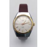 A Vintage Remex De Luxe Automatic Gents Watch. Burgundy leather strap. Stainless steel case -