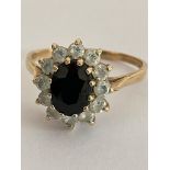 Impressive 9 carat GOLD RING, Having an oval cut SPINEL to centre with clear stone surround. 2.76