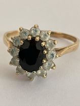 Impressive 9 carat GOLD RING, Having an oval cut SPINEL to centre with clear stone surround. 2.76