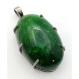 A Large Emerald Cabochon Pendant set in 925 Sterling Silver. 153.20ct. W- 36.50g. Comes in a