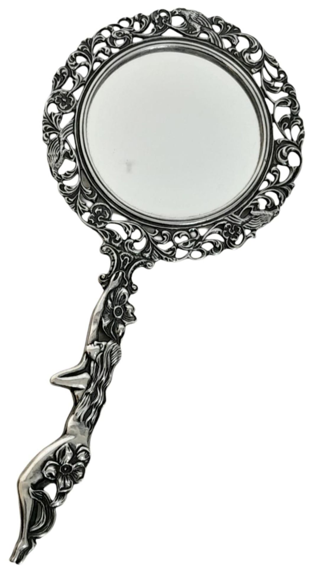 An Art Nouveau sterling silver vanity mirror, length: 16 cm, weight: 45 g.