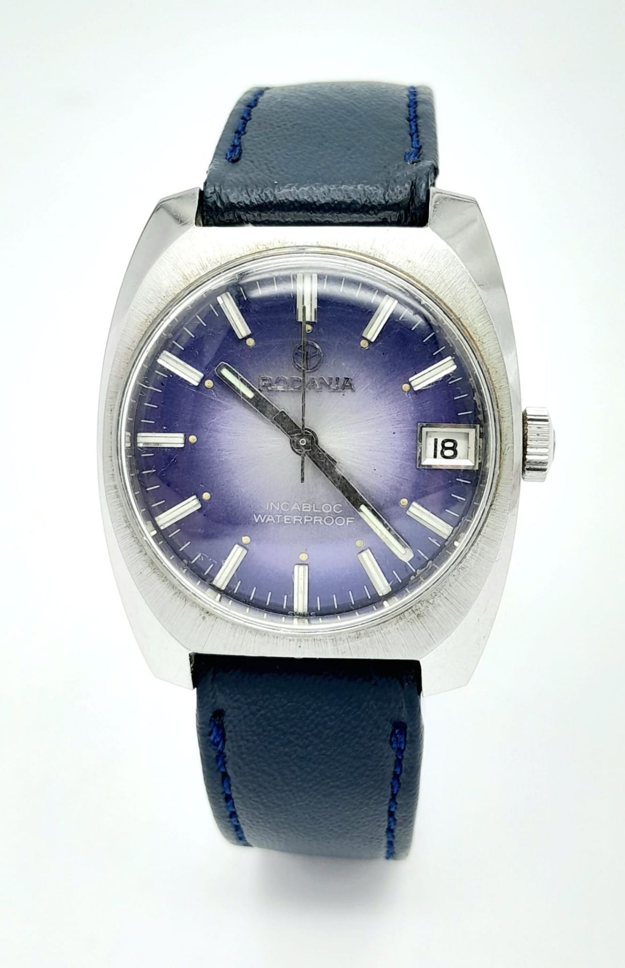 A Vintage Rodania Mechanical Gents Watch. Blue leather strap. Stainless steel case - 32mm. Purple