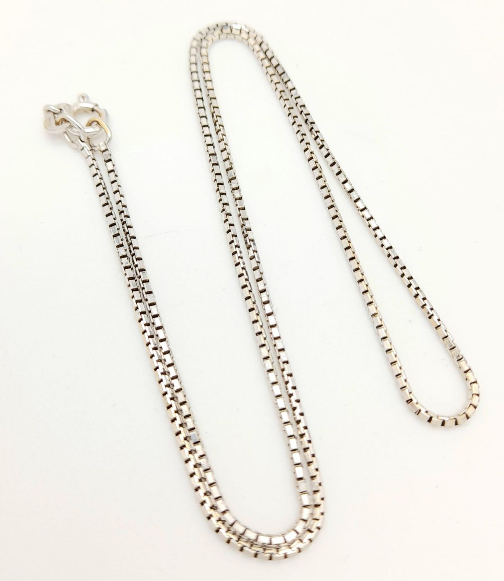 An 18K White Gold Link Necklace. Small rectangular links. 40cm. 4.56g weight.