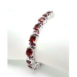 A Hessonite Garnet & Madagascar, Ruby Spacer Gemstone 925 Silver Bracelet. Weight - 28.9g. 18cm