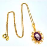 A VERY PRETTY 18K GOLD PENDANT WITH LARGE RUBY ON A 42cms GOLD CHAIN .5.3gms 16522