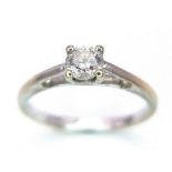 A 9K WHITE GOLD DIAMOND SOLITAIRE RING . 1.4gms size I