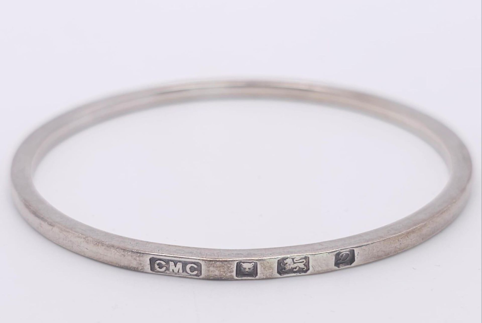 A vintage sterling silver bangle with full London hallmarks, 1978. Total weight 20.7G. Diameter 7cm.