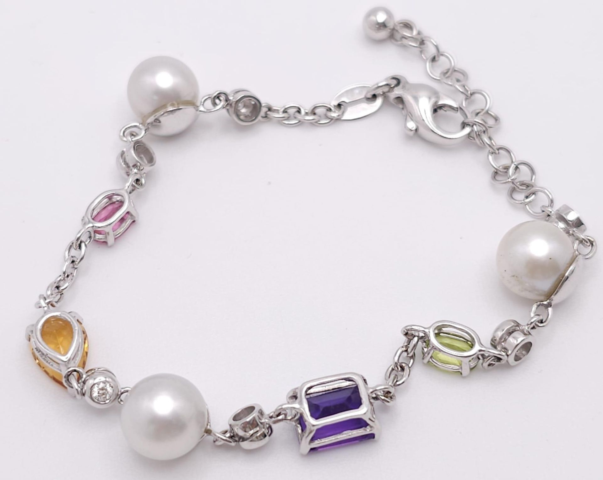 An 18 K white gold chain bracelet with a variety of gemstones (peridot, amethyst, citrine, etc) - Image 4 of 6