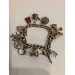 Vintage SILVER CHARM BRACELET, mounted with a selection of SILVER charms to include a Fawn with