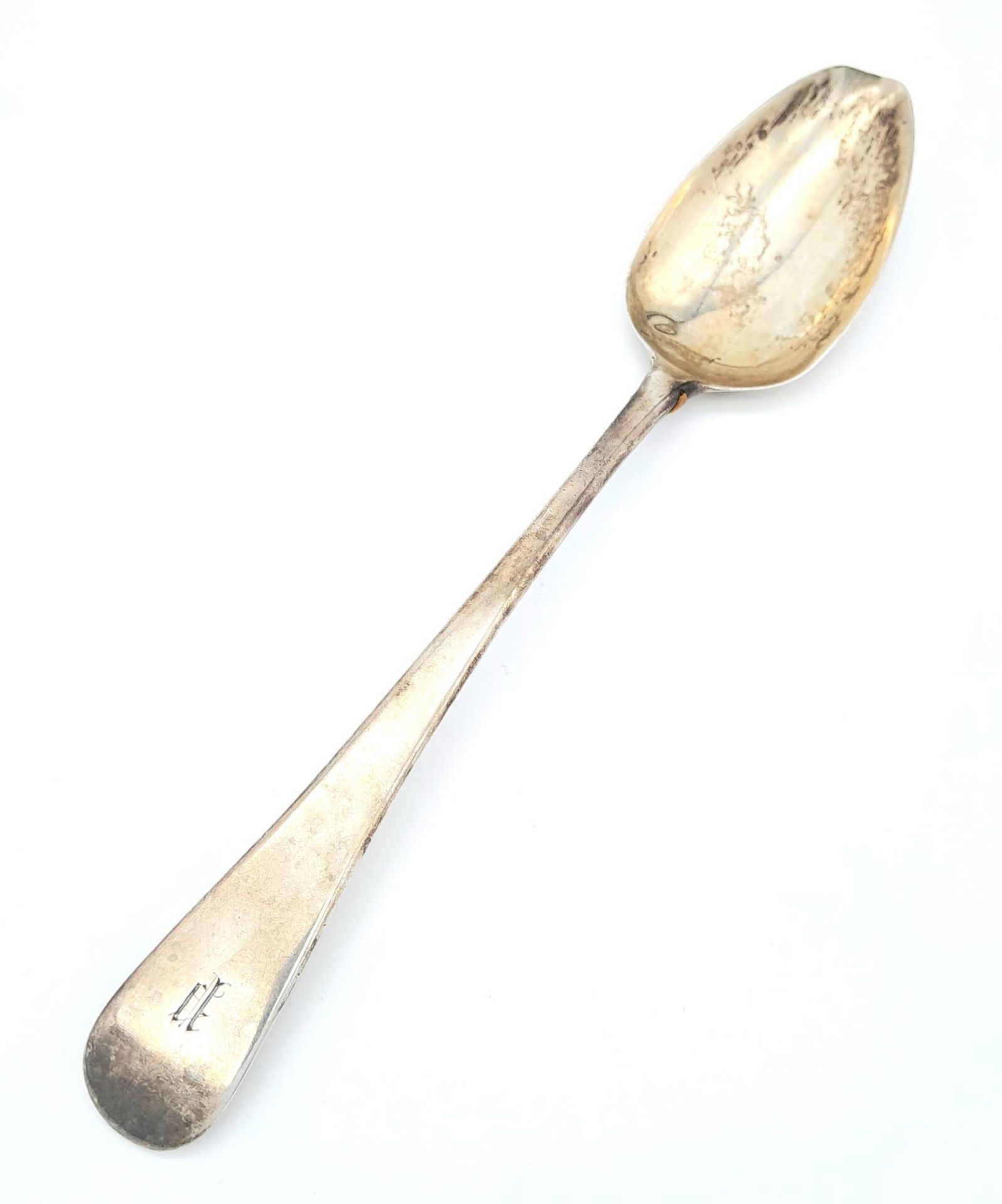 An antique Georgian sterling silver spoon with full London hallmarks, 1799. Total weight 63.1G.