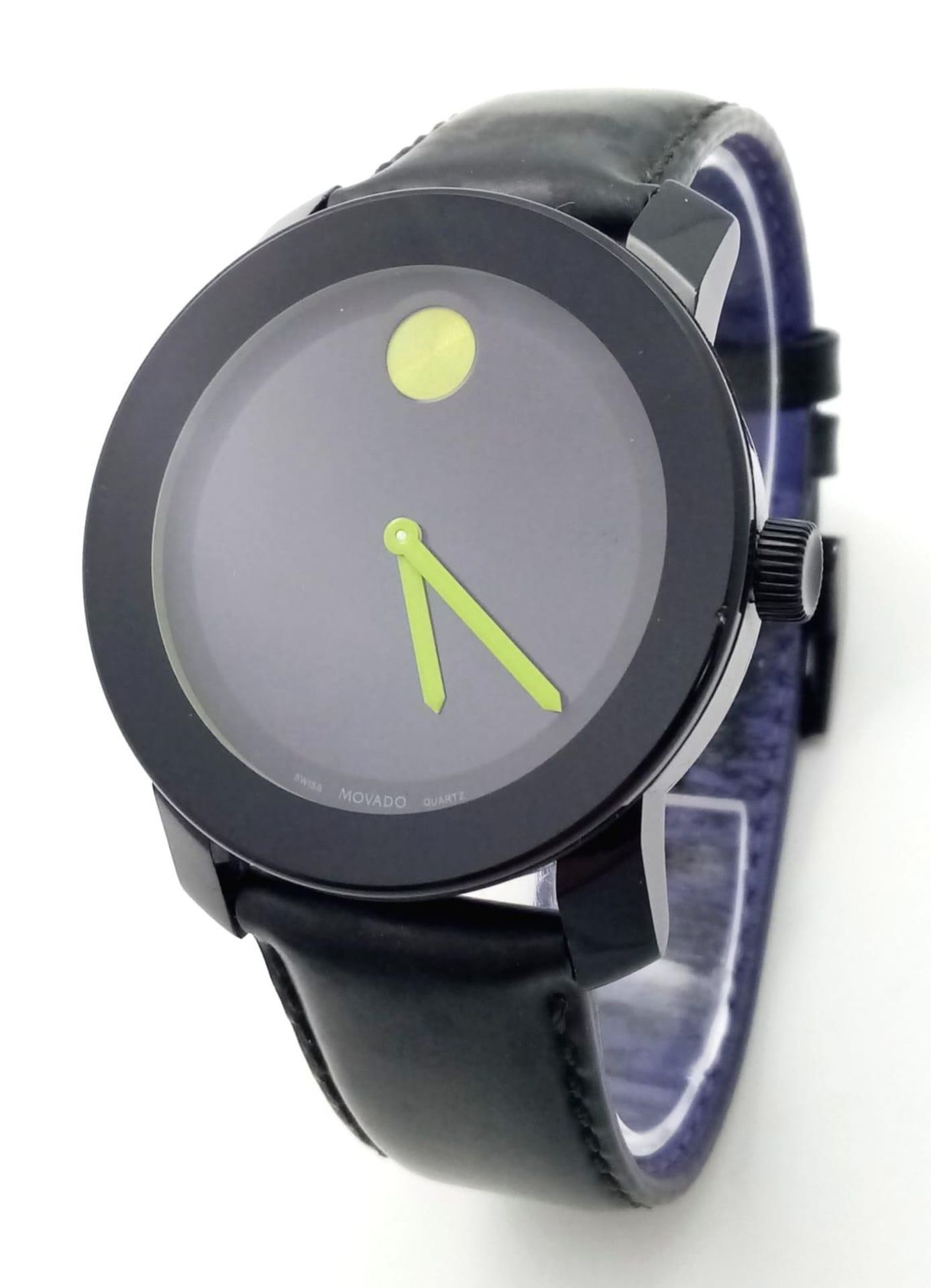 A Movado Bold Quartz Gents Watch. Black leather strap. Stainless steel and ceramic case - 43mm.