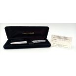 A Vintage Waterman 18K Gold Nibbed Fountain Pen. Decorative brushed white metal exterior. With