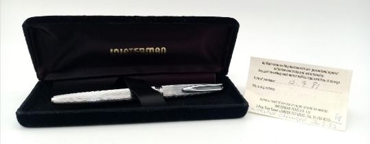 A Vintage Waterman 18K Gold Nibbed Fountain Pen. Decorative brushed white metal exterior. With