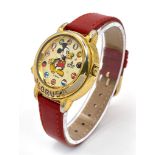 A Lorus Quartz Mickey Mouse Watch. Red leather strap. Gilded case - 34mm. Mickey dial. In working